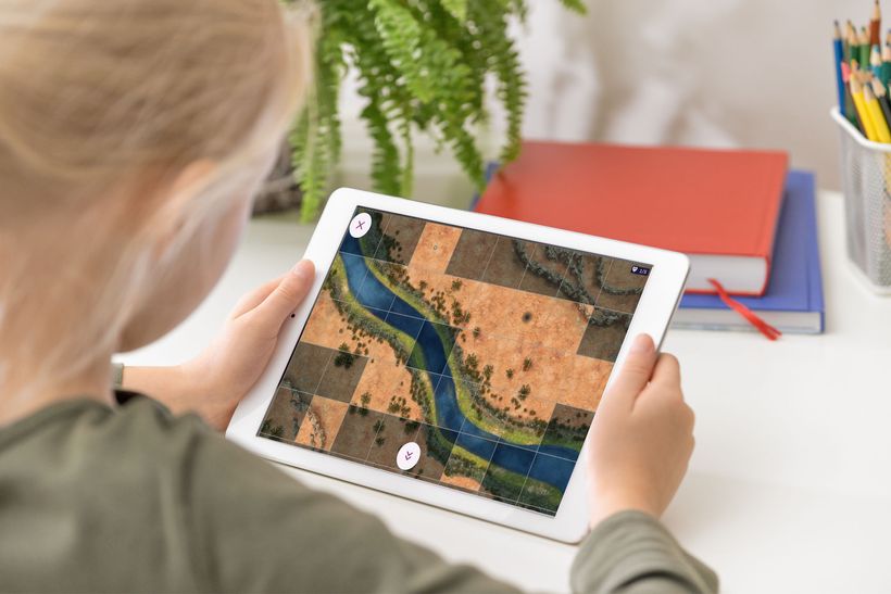 Image of girl with ipad playing the rocks and crystals app